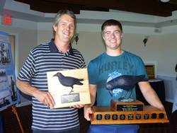 Carter Coblenz accepts Raven trophy at 2014 AGM